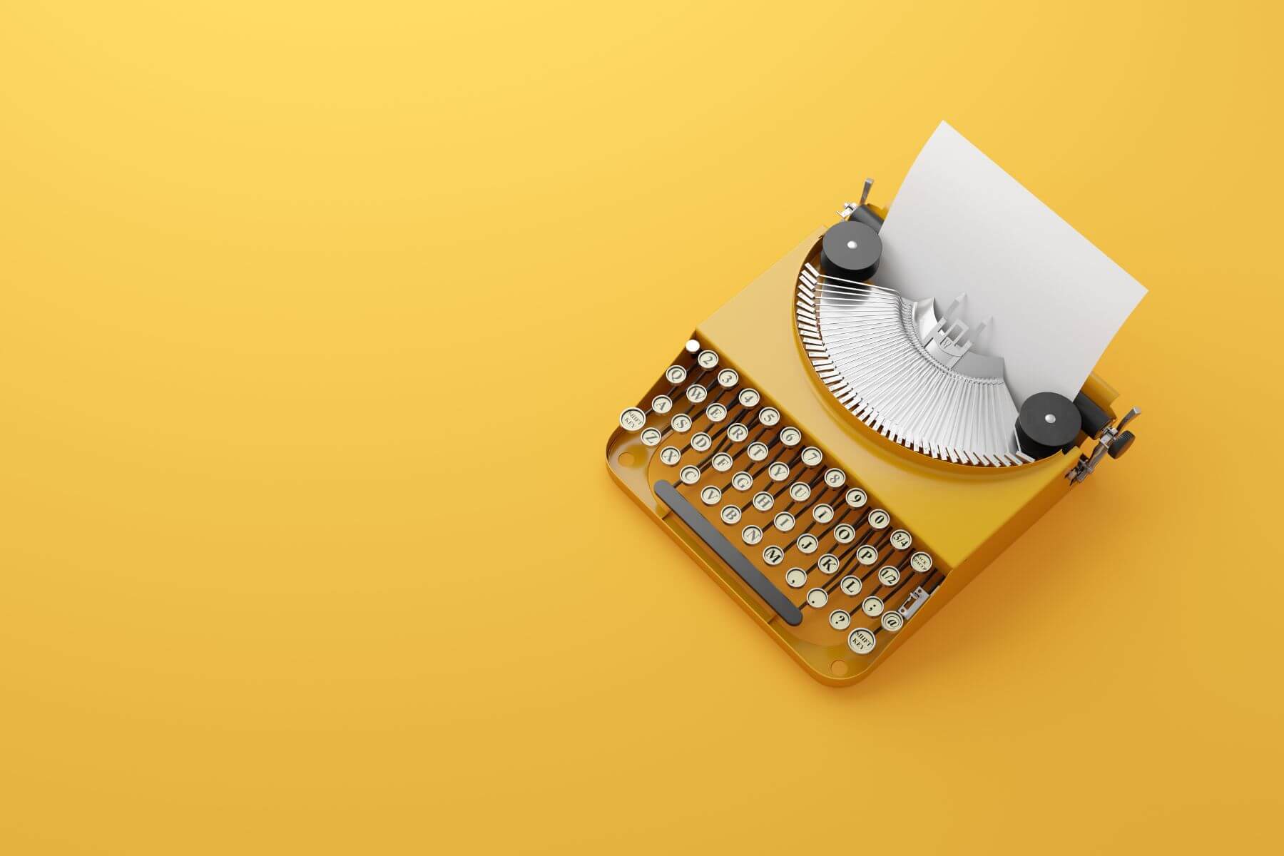Picture of yellow typewriter on yellow background to signify blog writing